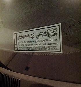 Screwed by towing-sticker.jpg