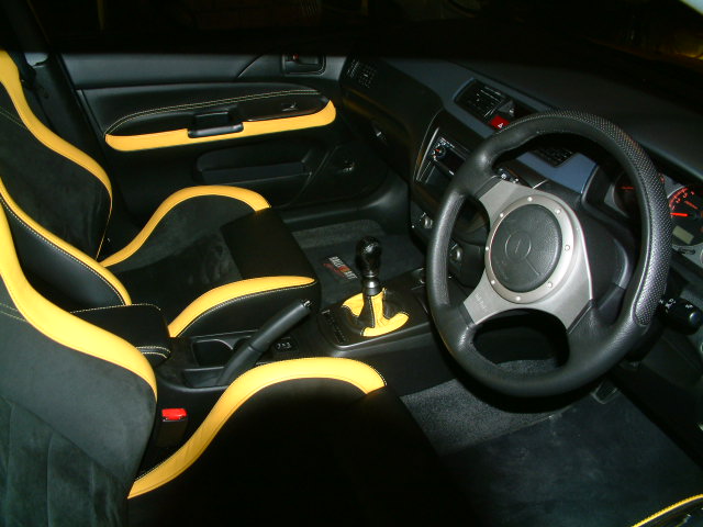yellow mitsubishi lancer 2022 interior