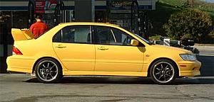 Who has black rims on a yellow lancer?-sean.jpg