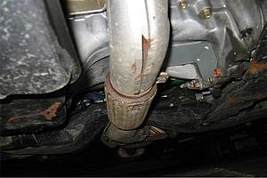 A major hole in a metal pipe under my car...problem?-pic-2.jpg